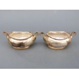 A pair of Victorian boat-shaped hallmarked silver salts with clear glass liners, Sheffield 1894,