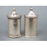 Two George V hallmarked silver peppers, Sheffield 1918 and 1933, maker Atkin Brothers, height 6.