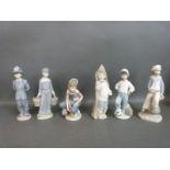 Five Lladro figures including football player,