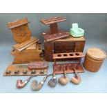 A collection of smoking related items including pipes,
