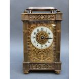 Edwardian brass carriage clock with pierced galleried and fretworked decoration,