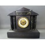 A late 19thC black slate mantel clock in classical architecture style inset with marbled decoration