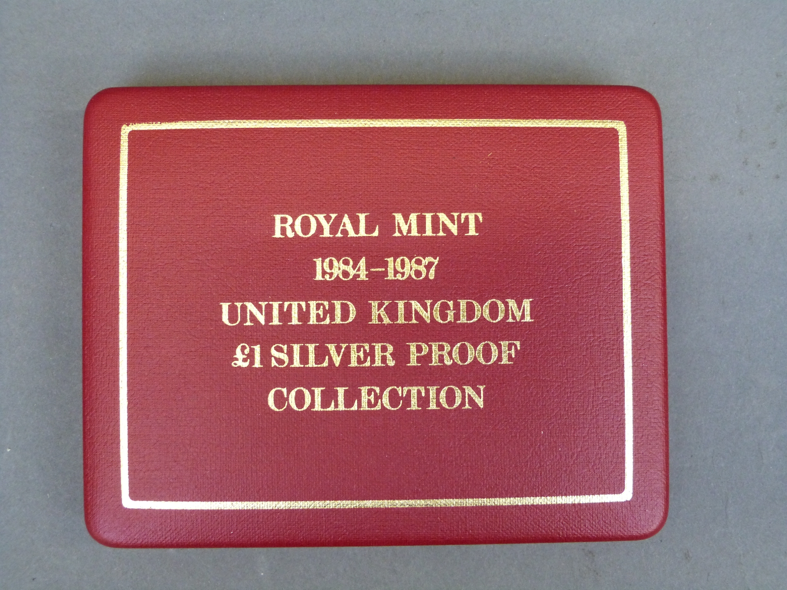 Royal Mint 1984-1987 UK £1 silver proof coin set, sealed and cased, - Image 2 of 2