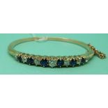 A Victorian bangle set with alternating diamonds and sapphires,