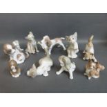 Nine Lladro dog and cat figures and one other