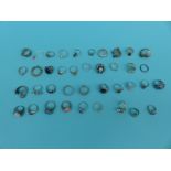 A collection of 39 silver/white metal dress rings including pearl, ruby,
