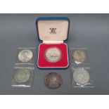 Six silver coins including Victorian crown, double florin, liberty dollar, Maria Theresia,