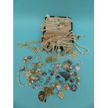 A collection of costume jewellery to include faux pearls, silver brooch, 9ct gold earrings,