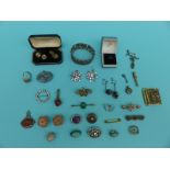 A collection of silver jewellery to include paste brooches, sweetheart brooches, bangle, seals,