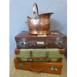 Three vintage suitcases including a leather example and copper coal scuttle