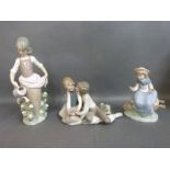 Three Lladro figurines including sweethearts,