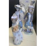 Five Lladro figurines including beach girl,