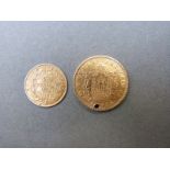 A Napoleon III 1865 20 franc gold coin (holed) together with an 1857 5 franc gold coin,
