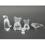 Five Swarovski cut glass animals comprising two teddy bears, a penguin,