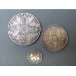 A Victoria double florin together with a florin and a threepence coin,