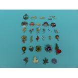A collection of brooches to include enamel examples,