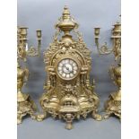 A substantial ornate brass clock garniture with enamelled Roman numerals inset to dial,