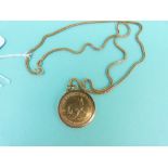A 1984 half Krugerrand in a yellow metal pendant mount on an 18ct gold chain,