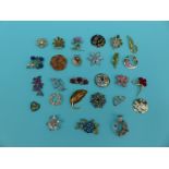 A collection of floral brooches some gem set,