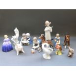 A collection of ceramic figures including Bing and Grondahl, Beswick, Royal Doulton,