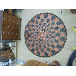 A large Nigerian circular handmade leather rug or wall hanging approximately 180cm diameter