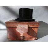 A black silk top hat by Lincoln Bennett & Co London, internal size approx. approx.