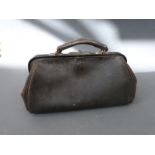 A black leather Gladstone bag approximately 36cm long