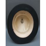 A black silk top hat, internal size approimately 20cm x 16cm.