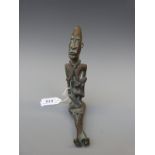 An African bronze/brass figure of a seated mother and child,