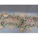 A 19thC straw work embroidered organdie border, possibly removed from garments,