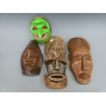 Three various African wooden masks and a Jatayu bird mask