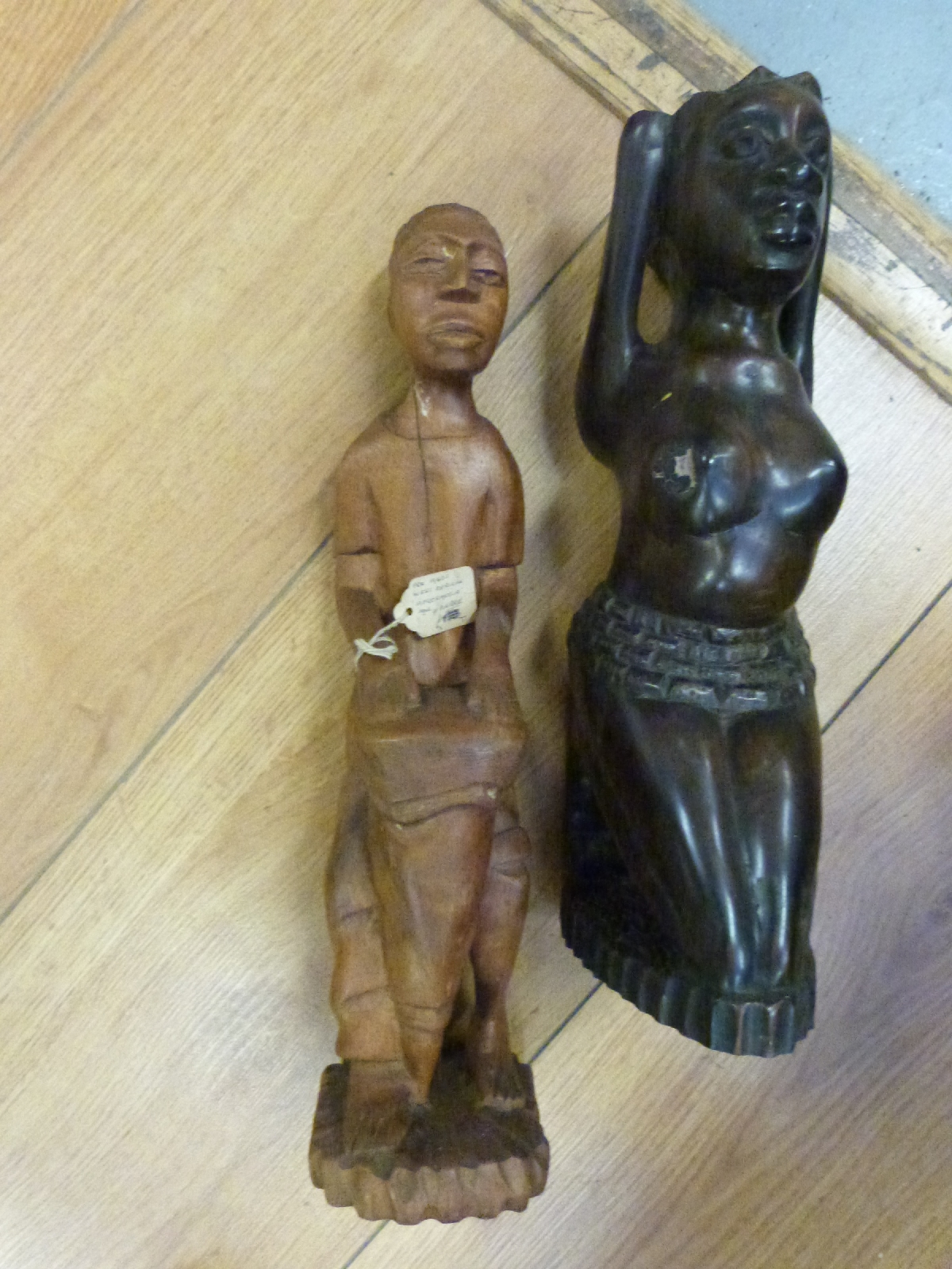 A large collection of African hardwood tribal figures and busts including pre 1940s Afrormosia