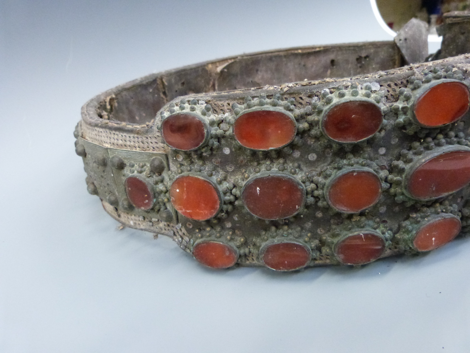 An 18thC/19thC lndo Persian wide leather belt with white metal engraved decoration set with - Image 4 of 4