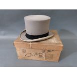 A grey felt top hat by Lock & Co London, boxed, internal size approx. approximately 19cm x 15.5cm.