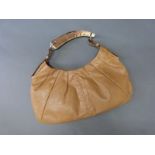 A vintage Yves Saint Laurent 'Mombasa' tan leather handbag, with deer antler handle,
