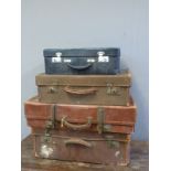 Four vintage leather and other suitcases
