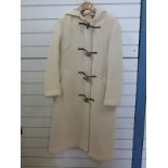 A cream wool ladies full length duffle coat by Gloverall,