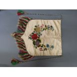 A 19thC embroidered hanging with appliqué floral decoration, with possible suffragette link,