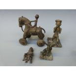 Four Ashanti brass figures including a wheeled horse and rider, a figure playing an instrument,