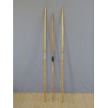 Three various wooden archery bows two handmade with leather bound grips.