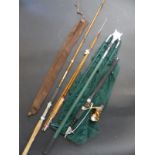 A collection of fishing rods and equipment to include keep net etc