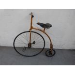 A child's bicycle formed as a Penny Farthing or Ordinary with Middlemore leather saddle