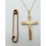 A 9ct gold cross pendant (2g) and a yellow metal brooch marked 15ct (3.