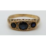 A 9ct gold ring set with sapphires and diamonds (size J)