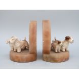 A pair of Art Deco onyx bookends cold painted bronze Sealyham terriers with puppies, H11.