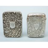 Two Victorian hallmarked silver vesta cases, one with floral repoussé decoration,