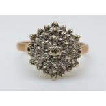 A 9ct gold ring set with diamonds in a cluster, 3.
