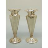 A pair of Victorian hallmarked silver tapering octagonal vases.