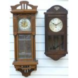 Two c1910 wall clocks one being a two train example with reeded and columned case,