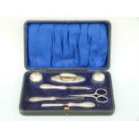 A cased early 20thC hallmarked silver manicure set